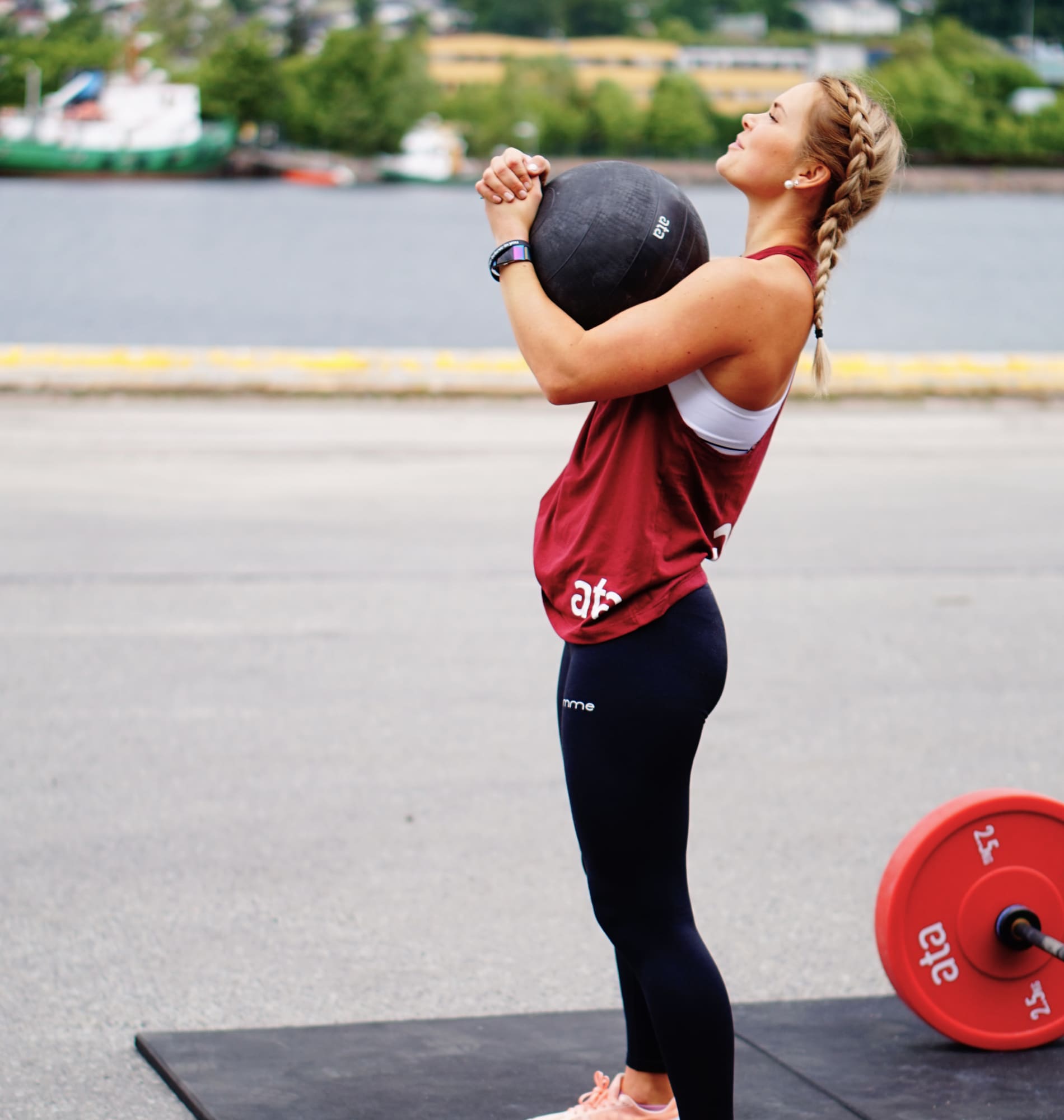 Woman lifting heavy ball service4@2x